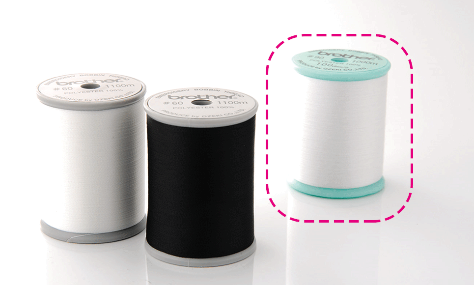 White embroidery thread on green spool for Brother embroidery machines