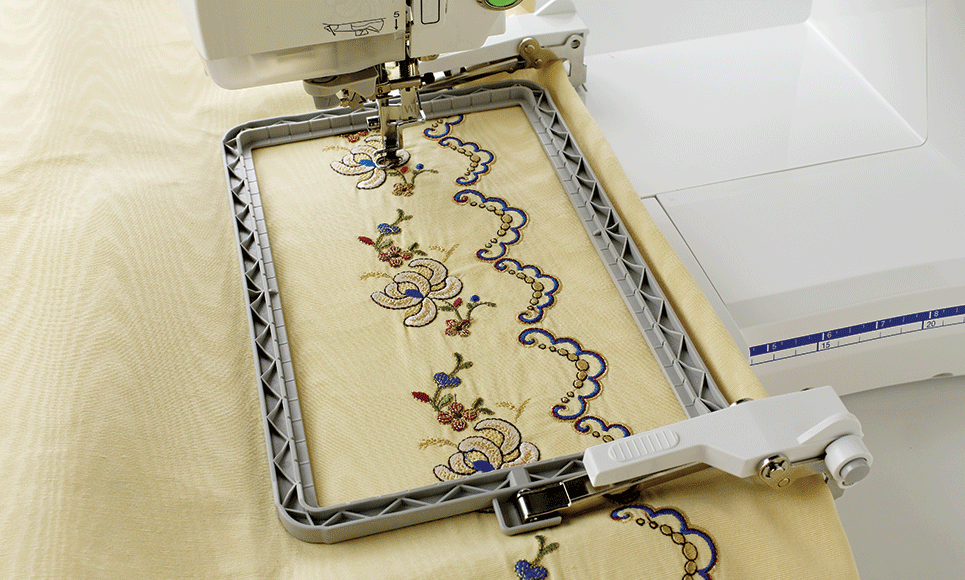 Flower border embroidered on yellow fabric using border frame BF2
