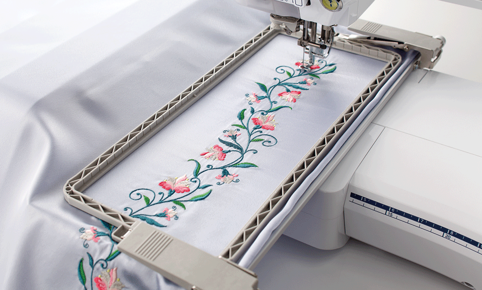 Continuous flower embroidery on white fabric using border frame BF3