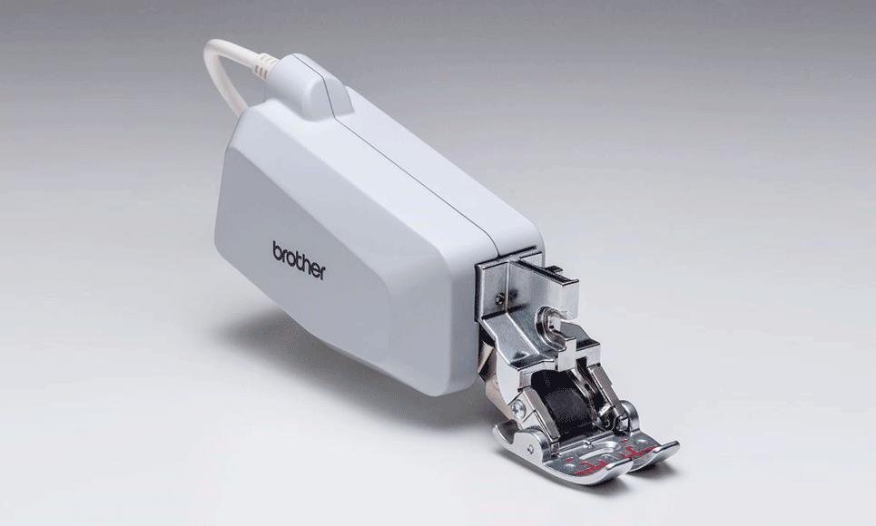 Brother Compact Dual Feed foot on grey background