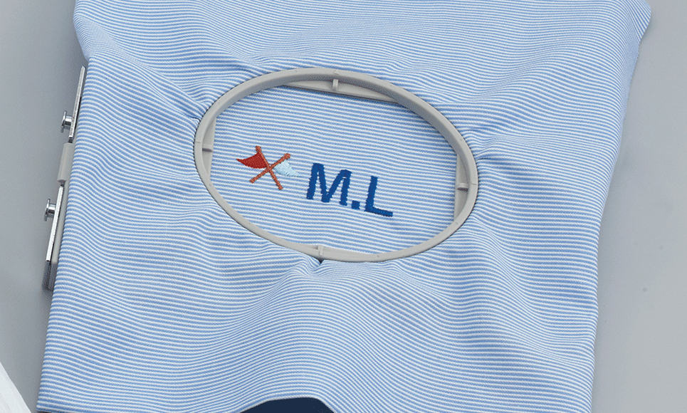 Grey 2 x 6 oval frame EF61 with embroidered flags and initials on blue