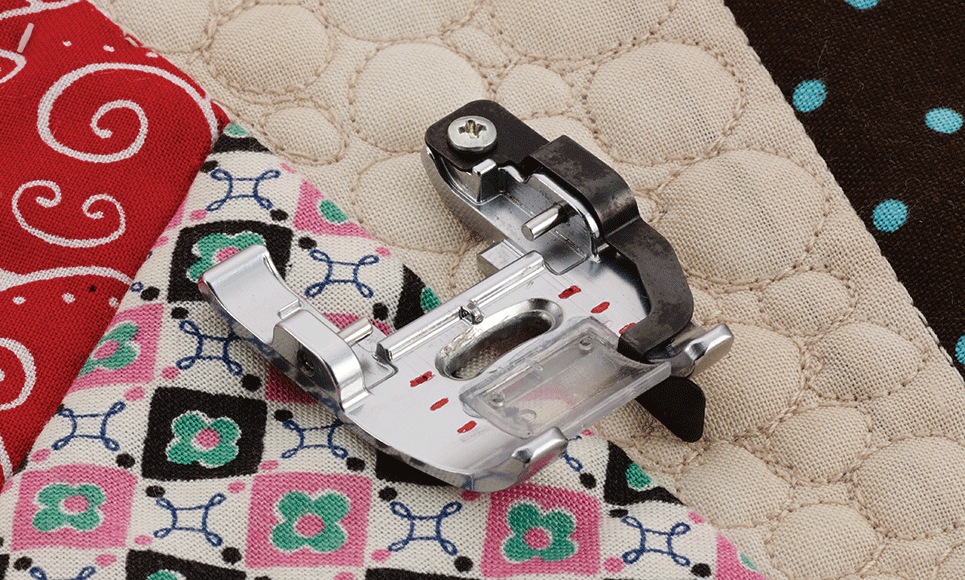 Quarter inch dual feed foot F076 on mixed coloured quilt